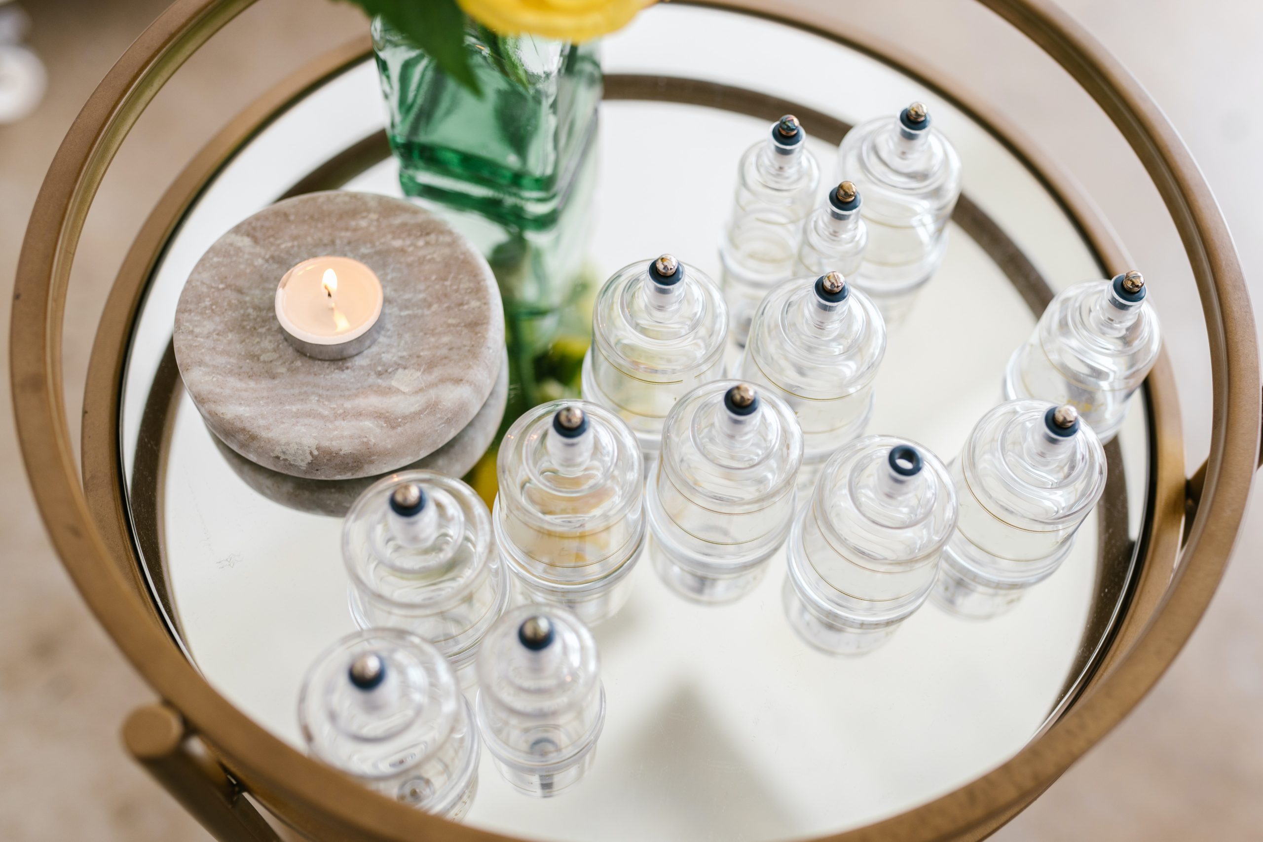 Clean glass cupping therapy cups and traditional wellness equipment prepared for treatment.